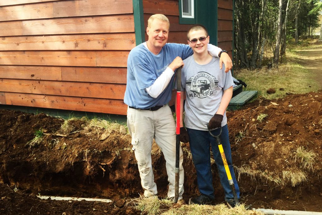 Alaska Volunteer Opportunities - A volunteer work team helps to prepare the Tanalian Bible Camp facility for the season.